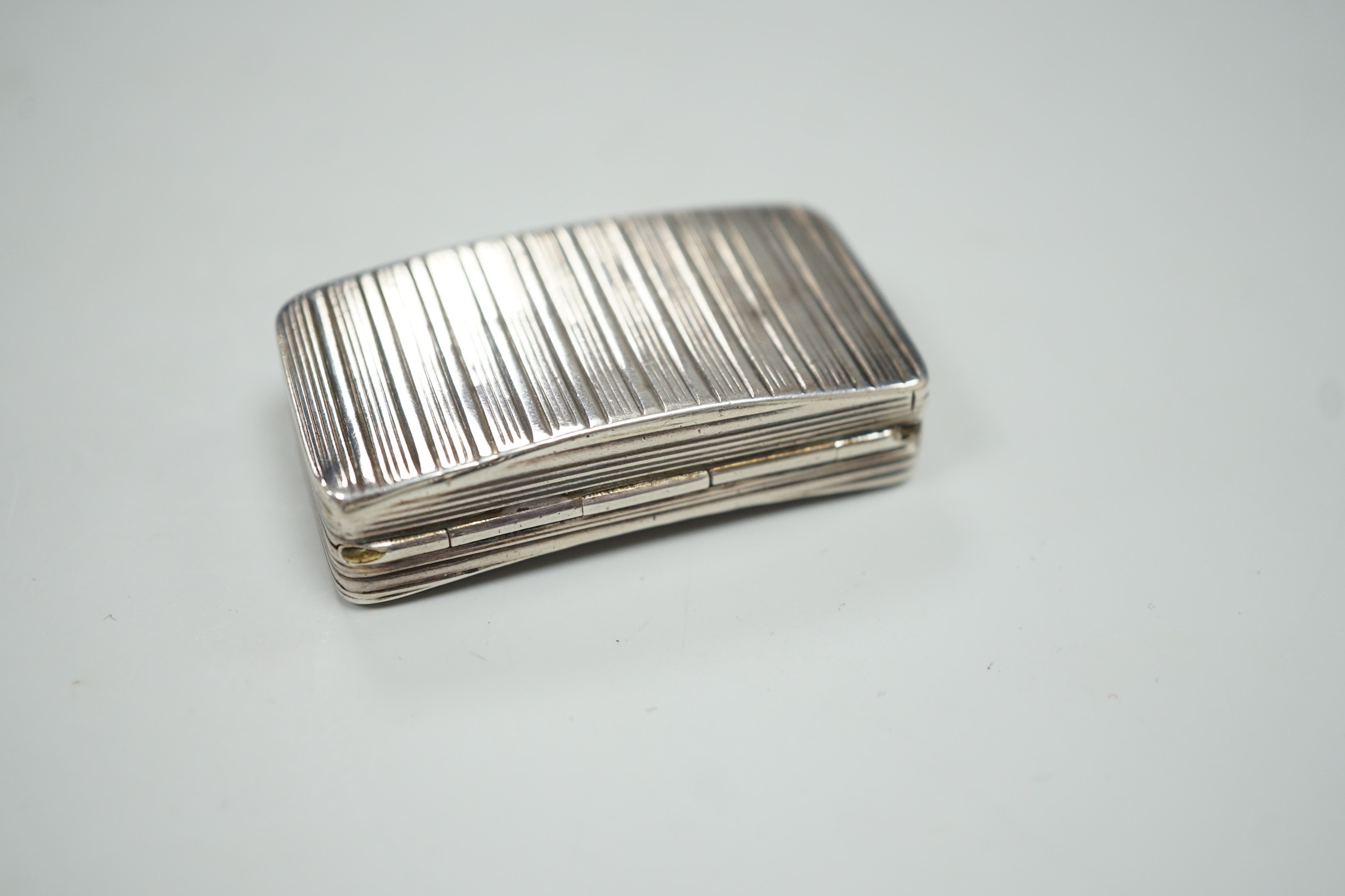 A George III ribbed silver snuff box, maker ?S, Birmingham, 1810, 58mm.